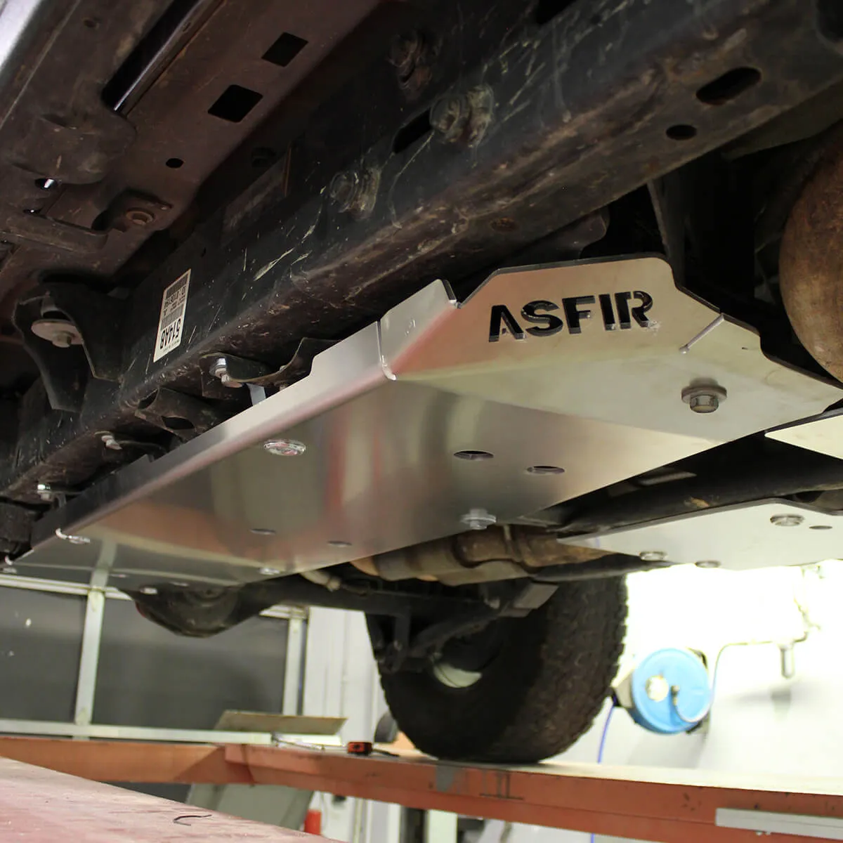 ASFIR fuel tank skid plate on an off-road truck