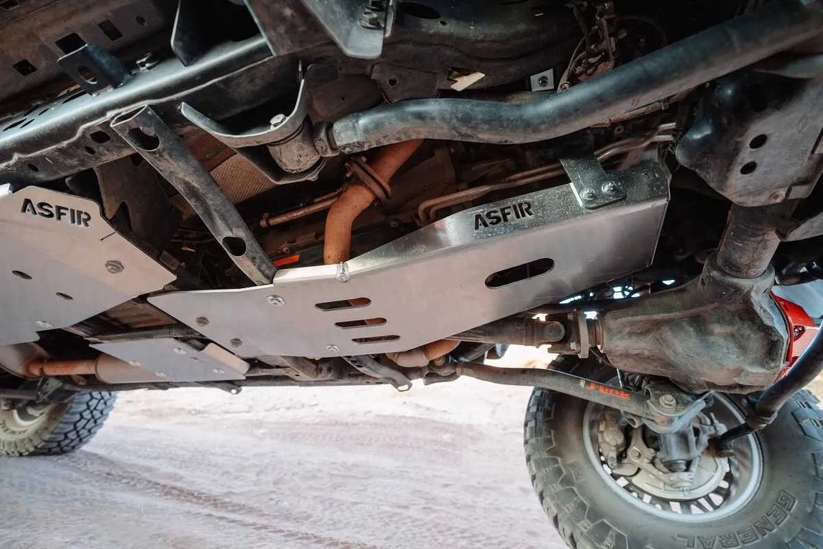 ASFIR aluminum skid plates under a truck on the trail